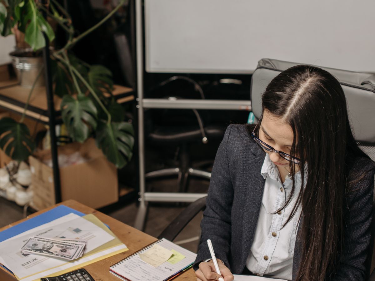 An accounting clerk doing the books on a laptop