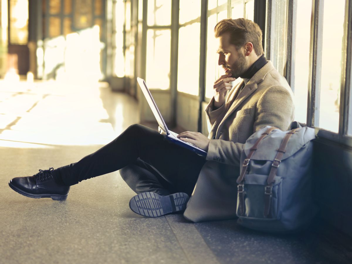 A traveler recording an expense by voice on a phone